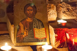 Prayer space with candles and icon of Jesus
